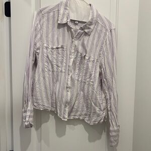Purple and white stripped shirt. Shorter in length